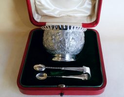 Cased Chinese bowl and silver sugar tongs