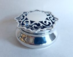 Edwardian silver box with pierced lid