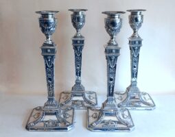 Set of four 20th century silver candlesticks